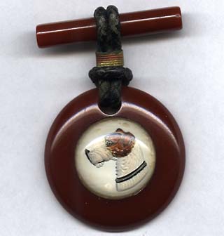 1930s Cinnamon Bakelite Airdale Pin